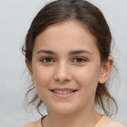 Joyful white child female with medium  brown hair and brown eyes