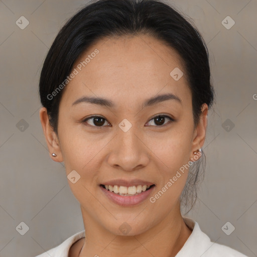 Joyful latino young-adult female with medium  brown hair and brown eyes