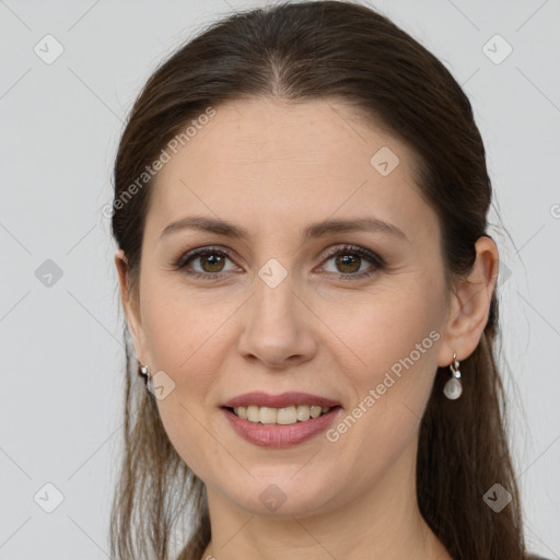 Joyful white young-adult female with long  brown hair and grey eyes