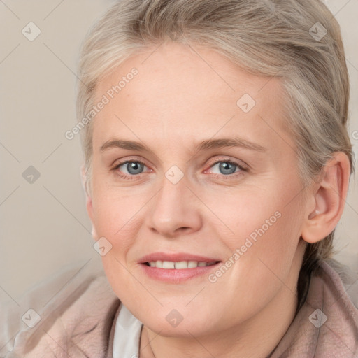 Joyful white adult female with medium  brown hair and blue eyes