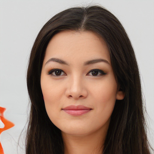 Joyful asian young-adult female with long  brown hair and brown eyes
