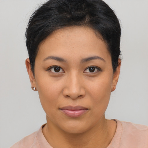 Joyful asian young-adult female with short  brown hair and brown eyes