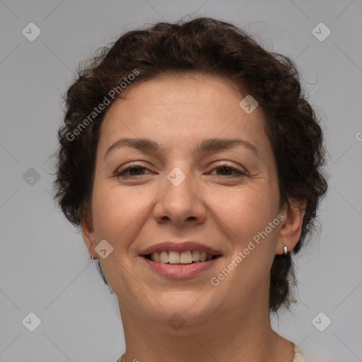 Joyful white adult female with short  brown hair and brown eyes