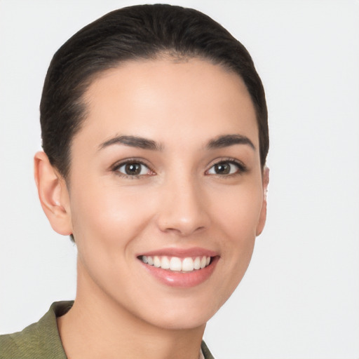 Joyful white young-adult female with short  black hair and brown eyes