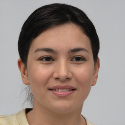 Joyful asian young-adult female with short  brown hair and brown eyes