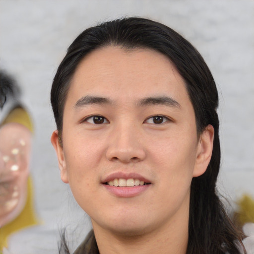 Joyful white young-adult male with medium  black hair and brown eyes