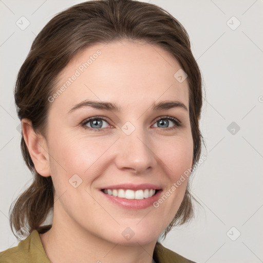 Joyful white young-adult female with medium  brown hair and grey eyes