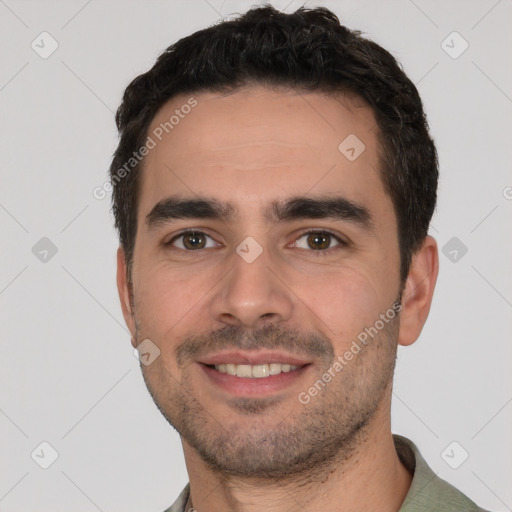 Joyful white young-adult male with short  black hair and brown eyes