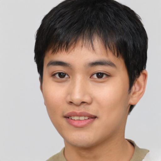 Joyful asian young-adult male with short  black hair and brown eyes