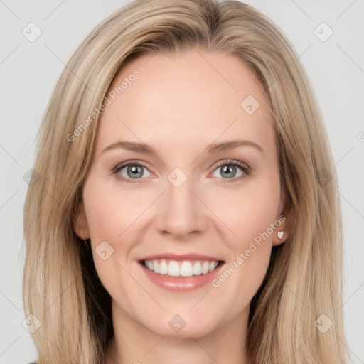 Joyful white young-adult female with long  brown hair and blue eyes