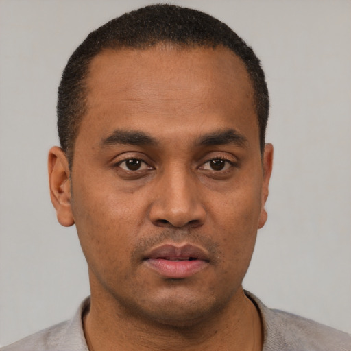 Neutral black young-adult male with short  brown hair and brown eyes