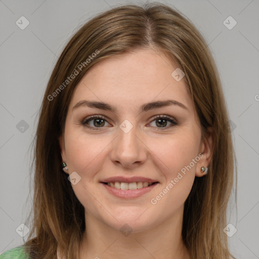 Joyful white young-adult female with medium  brown hair and green eyes