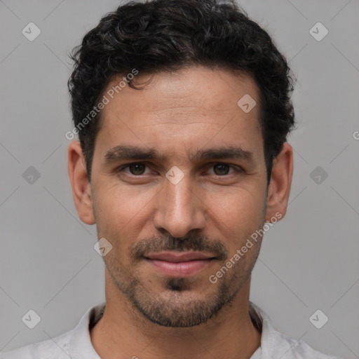 Joyful white young-adult male with short  black hair and brown eyes