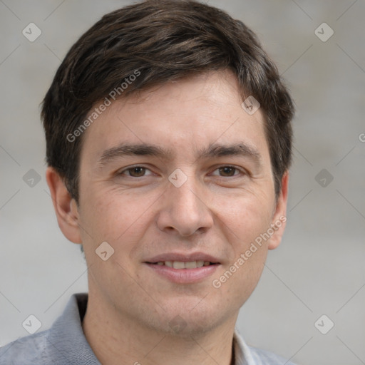 Joyful white adult male with short  brown hair and grey eyes