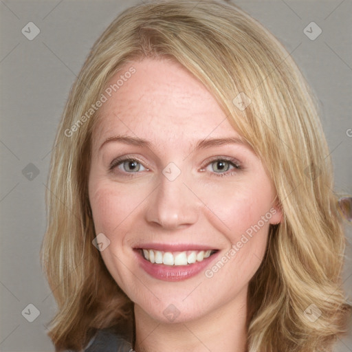 Joyful white young-adult female with medium  brown hair and blue eyes