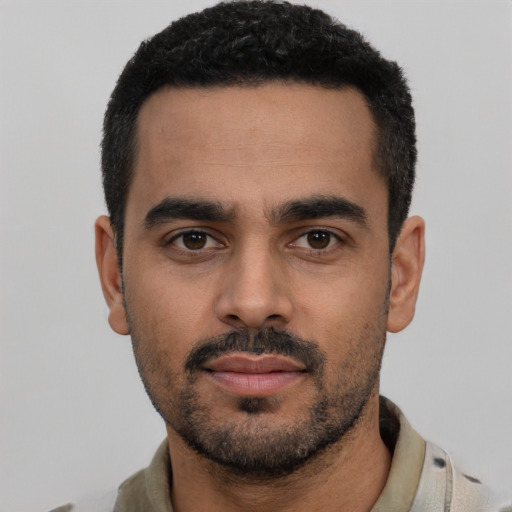 Neutral latino young-adult male with short  black hair and brown eyes