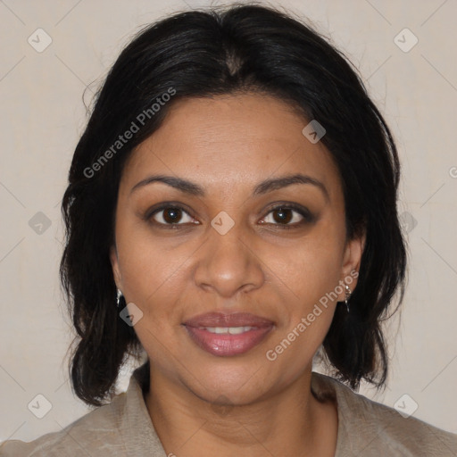 Joyful black adult female with medium  brown hair and brown eyes