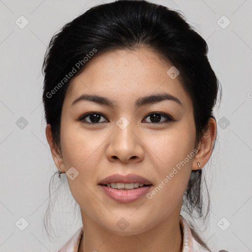 Joyful asian young-adult female with medium  black hair and brown eyes