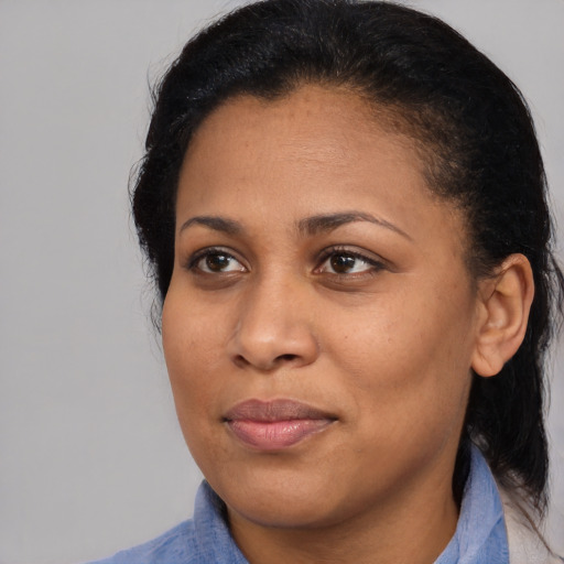Joyful black young-adult female with medium  black hair and brown eyes