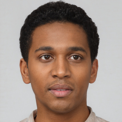 Neutral latino young-adult male with short  brown hair and brown eyes