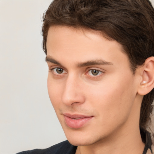 Neutral white young-adult male with long  brown hair and brown eyes