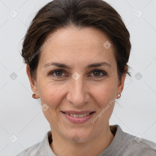 Joyful white adult female with short  brown hair and brown eyes