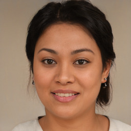 Joyful asian young-adult female with medium  brown hair and brown eyes