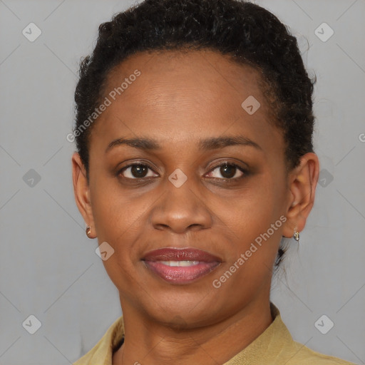 Joyful black young-adult female with short  brown hair and brown eyes