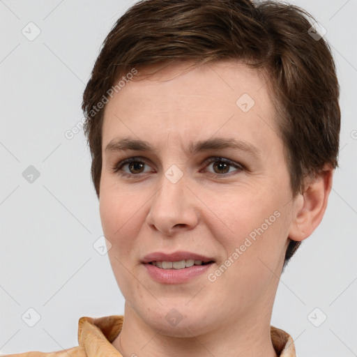 Joyful white young-adult female with short  brown hair and brown eyes