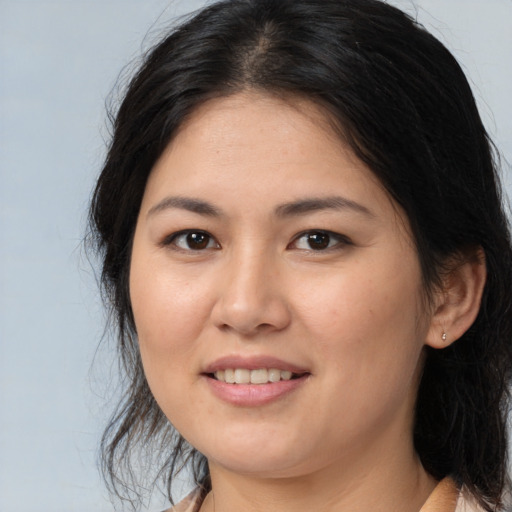 Joyful white young-adult female with medium  brown hair and brown eyes
