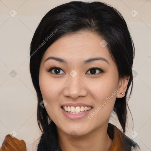 Joyful asian young-adult female with medium  black hair and brown eyes