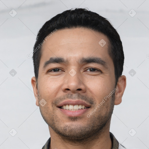 Joyful asian young-adult male with short  black hair and brown eyes