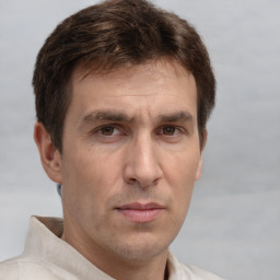 Neutral white adult male with short  brown hair and brown eyes