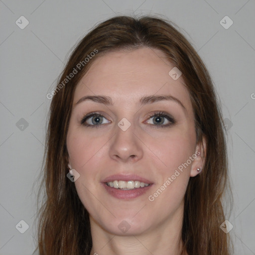 Joyful white young-adult female with long  brown hair and blue eyes