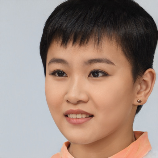 Joyful asian young-adult female with short  brown hair and brown eyes