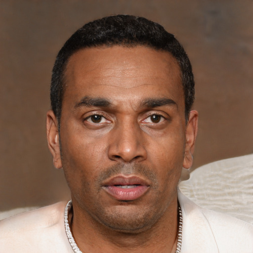 Neutral black adult male with short  black hair and brown eyes