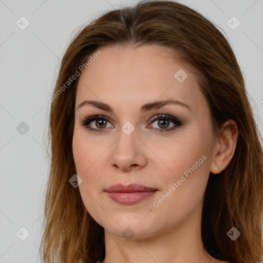 Joyful white young-adult female with long  brown hair and green eyes