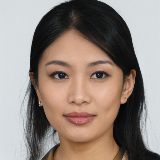 Joyful asian young-adult female with long  black hair and brown eyes