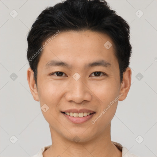 Joyful asian young-adult male with short  black hair and brown eyes