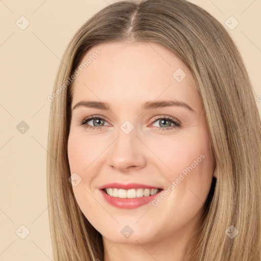 Joyful white young-adult female with long  brown hair and brown eyes