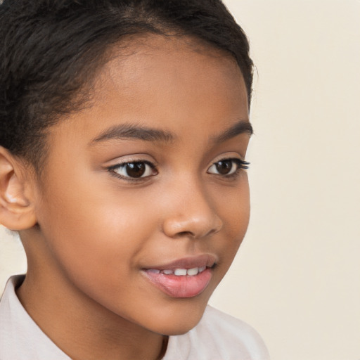 Joyful latino child female with short  brown hair and brown eyes