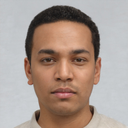 Neutral latino young-adult male with short  black hair and brown eyes