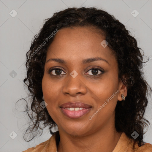 Joyful black young-adult female with long  brown hair and brown eyes