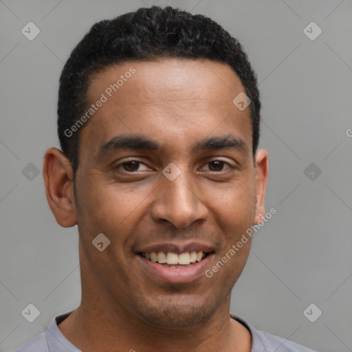 Joyful latino young-adult male with short  brown hair and brown eyes