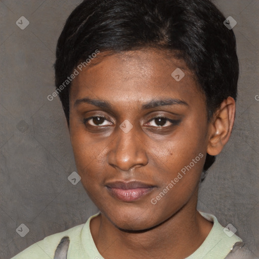 Joyful black young-adult female with short  brown hair and brown eyes