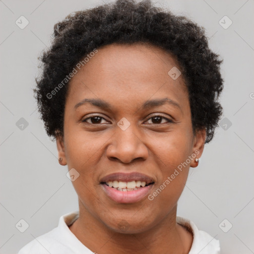 Joyful black adult female with short  brown hair and brown eyes