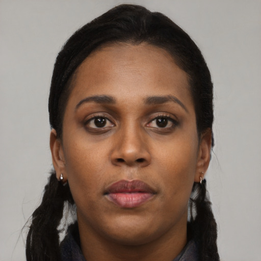 Neutral black young-adult female with long  brown hair and brown eyes
