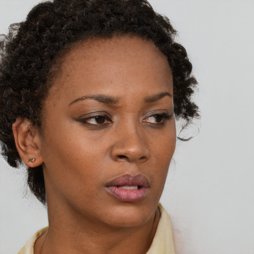 Neutral black young-adult female with short  brown hair and brown eyes