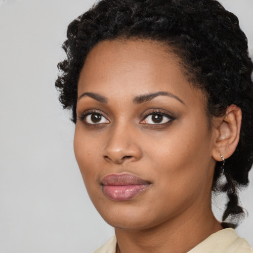 Joyful latino young-adult female with medium  black hair and brown eyes