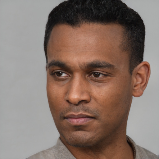 Neutral latino young-adult male with short  black hair and brown eyes